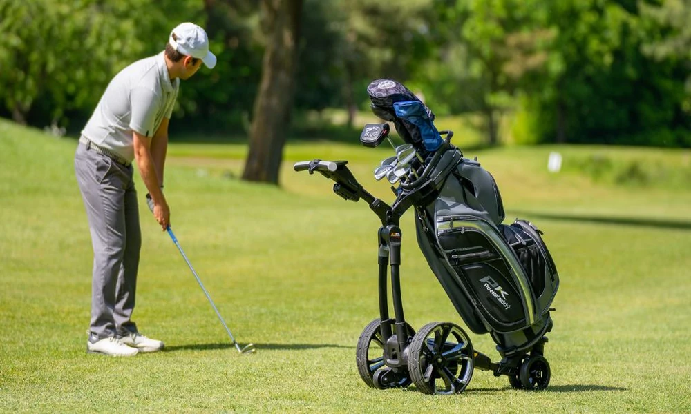 How do electric golf trolleys work on the course?